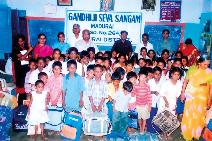 Children receiving educational books